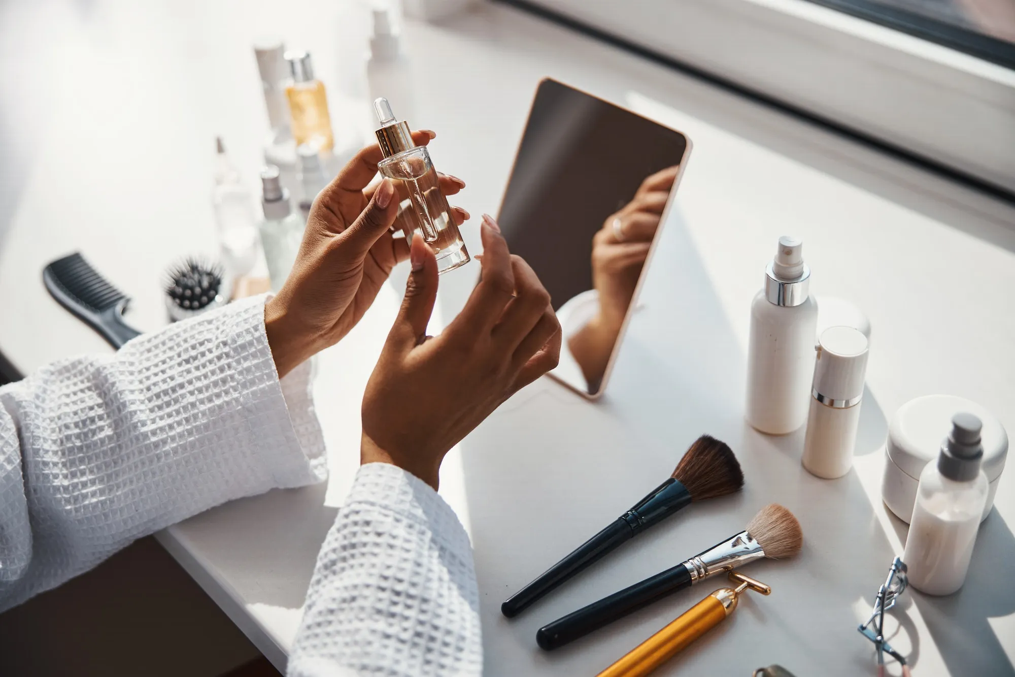 female-hands-holding-bottle-of-vitamin-face-serum